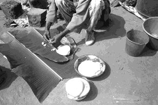 cd1709-32-f213-93a.jpg The ritual meal is put out on banana leaves